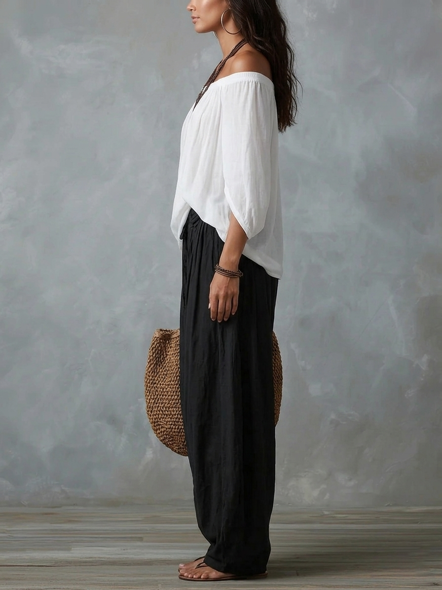 Ensemble composé d'un haut blanc à épaules dénudées et d'un pantalon ample style lanterne
